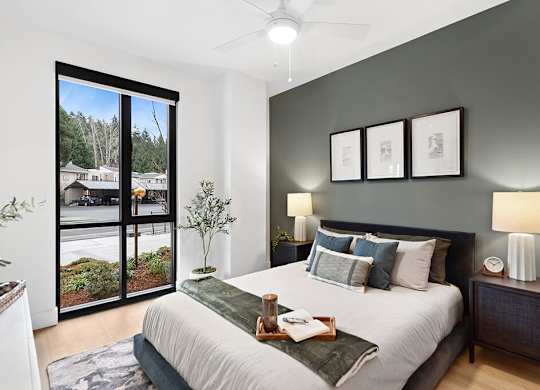 Bedroom with accent wall at The Brynn in Kirkland WA