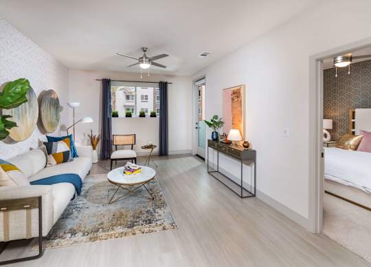 View of living room from kitchen at Avel Apartment Homes in Orange CA