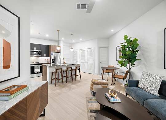 Model Concrete Design Package Living Room and Kitchen at East Bend Apartments in Houston