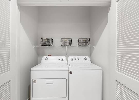 Model Concrete Design Package Washer and Dryer at East Bend Apartments in Houston TX