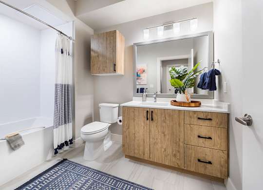 Bathroom with shower and sink at Altitude Apartments in South San Francisco CA