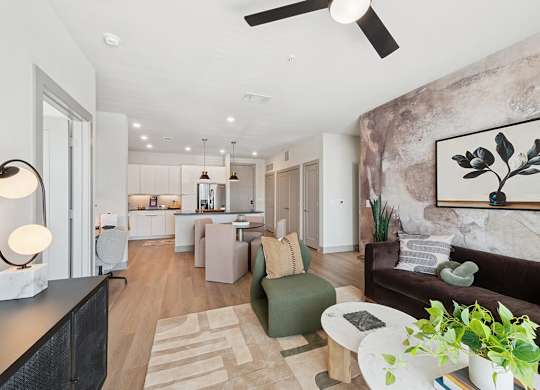 Living room with ceiling fan at Heights at 1520 Apartments in Houston TX