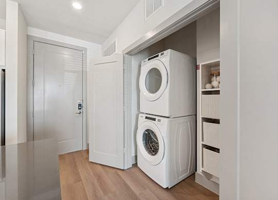 In unit stacked laundry at Heights at 1520 Apartments in Houston TX