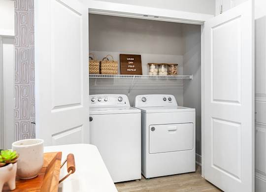 Side by side washer and dryer at Cala Apartments in Austin TX