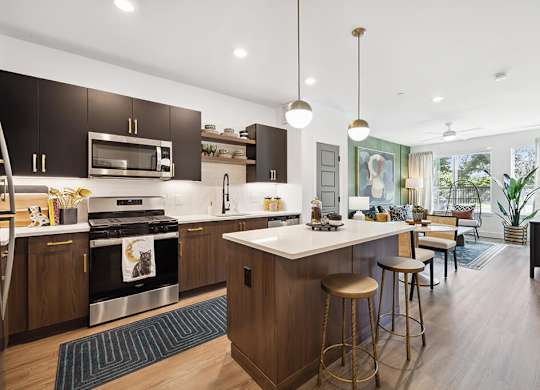 Model kitchen and living room at Jayden Apartments in Peabody MA