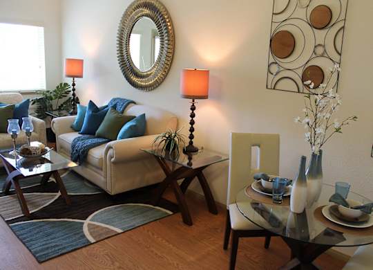 Model Living Room and Dining Table at The Lodge at Morgan Hills Apartments in Morgan Hill CA
