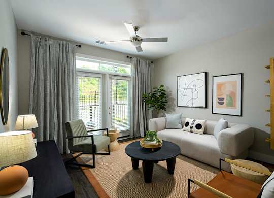 Living room with ceiling fan at Verge Apartments in Atlanta GA