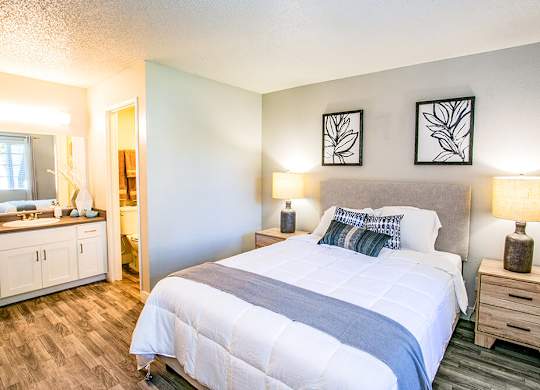 a bedroom with a bed and a bathroom
