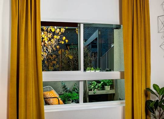 Model Pewter Bedroom Solar Shade at Chroma Apartment Homes in Canoga Park CA