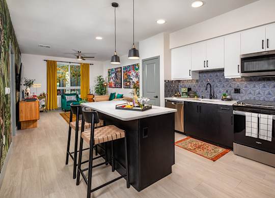 Model Pewter Kitchen and Living Room at Chroma Apartment Homes in Canoga Park CA