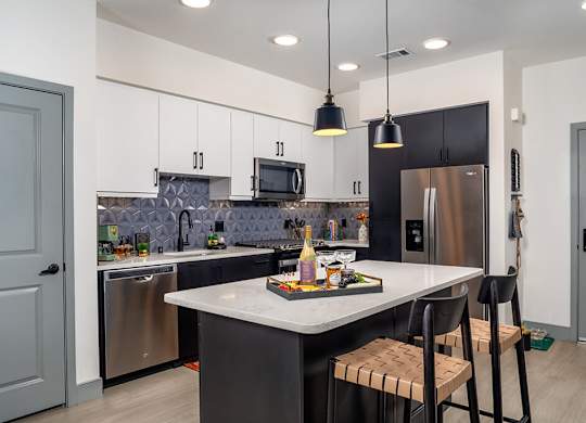 Model Pewter Kitchen Angled at Chroma Apartment Homes in Canoga Park CA