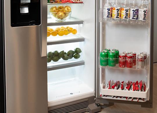 Model Pewter Kitchen Fridge Open at Chroma Apartment Homes in Canoga Park CA