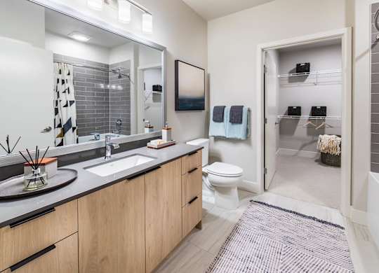 Bathroom with closet at Aspect at Totem Lake Apartments in Kirkland WA