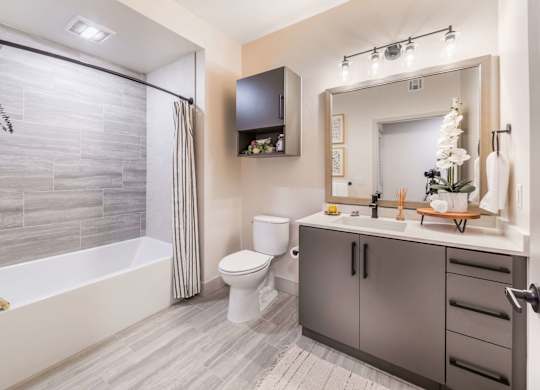 Slate finish bathroom with high end finishes at Avel Apartment Homes in Orange CA