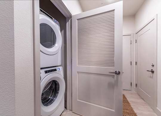 In unit stacked laundry at Olivean Apartments in Broomfield CO