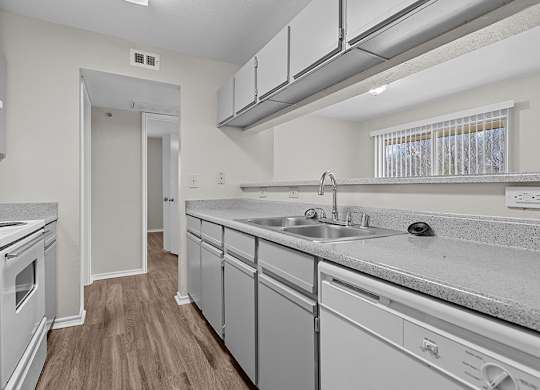 Modern kitchen with breakfast bar at Valley Ridge Apartments in Lewisville TX