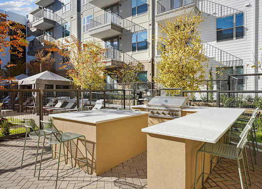 Outdoor BBQ area at The Sevens in Dallas TX