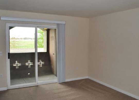 Living room patio door at Bristol Apartment Homes in Dixon CA