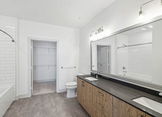 Bathroom with dual sinks at The Braydon Apartments in Napa CA