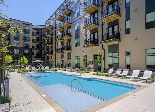 Pool with chairs at 333 Ellington Apartments in Gaithersburg MD