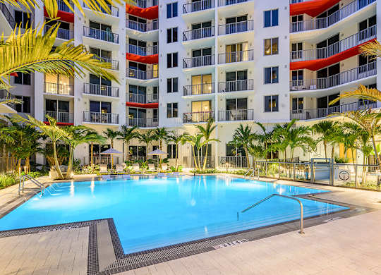Swimming pool at dusk at Treo Apartments in Fort Lauderdale FL