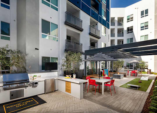 Pool Luminescence Grill and Fite Table On at Chroma Apartment Homes in Canoga Park CA