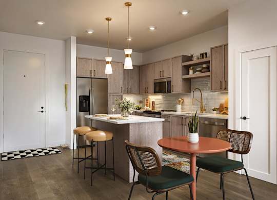 Kitchen in Brass Design package at Merrick on Midway Apartments in Farmers Branch TX