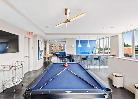 Resident clubhouse billiards table at Bradley Braddock Road Station Apartments in Alexandria VA