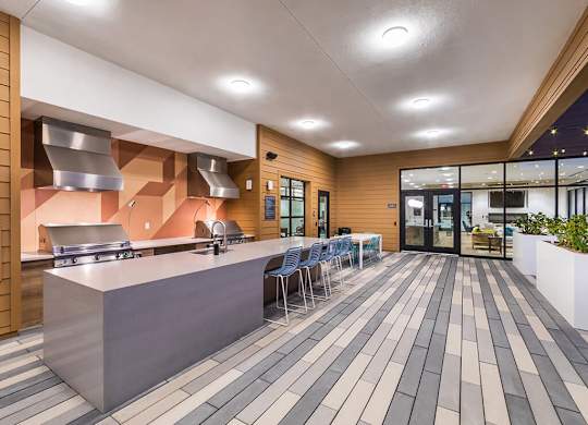 Rooftop Deck Grills at Dusk at Embark Apartments in Fremont CA
