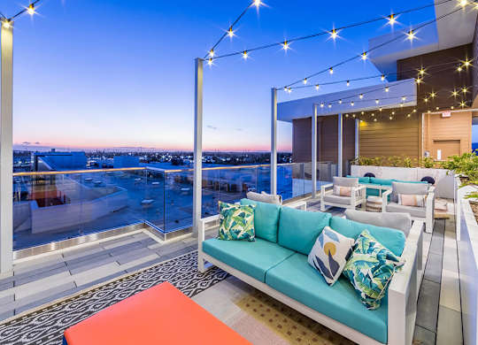 Rooftop Deck Seating at Dusk at Embark Apartments in Fremont CA