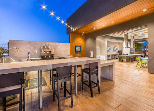 Rooftop lounge with kitchen at Avel Apartment Homes in Orange CA