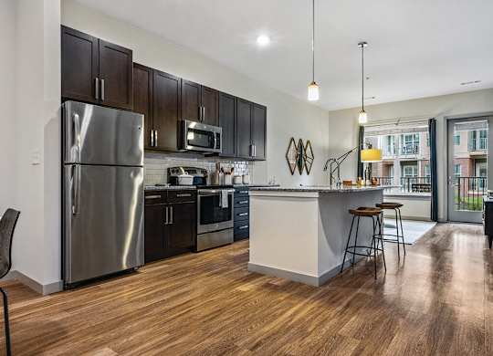 Kitchen with island seating at The Slate at Andover Apartments in Andover MA