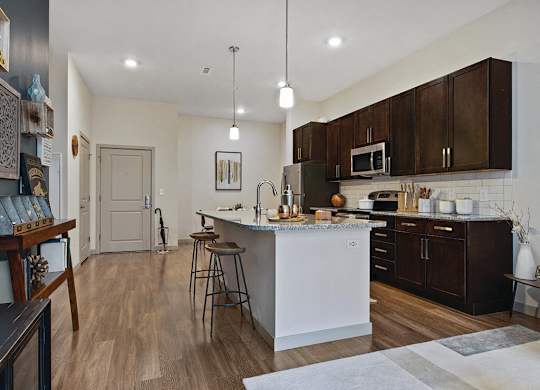 Kitchen with dark cabinets at The Slate at Andover Apartments in Andover MA