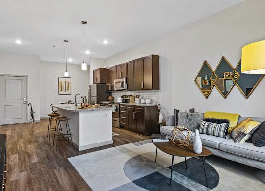 View of kitchen and living room at The Slate at Andover Apartments in Andover MA
