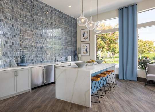 Social lounge kitchen at Sierra at Otay Ranch Apartments in Chula Vista CA