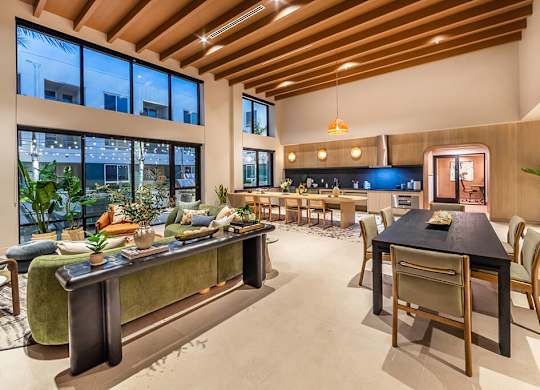 Social Lounge Seating and Kitchen at Dusk at Bowen Apartments in San Diego CA