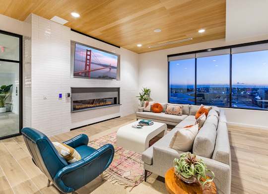 Social Lounge Seating Area and Fireplace at Embark Apartments in Fremont CA