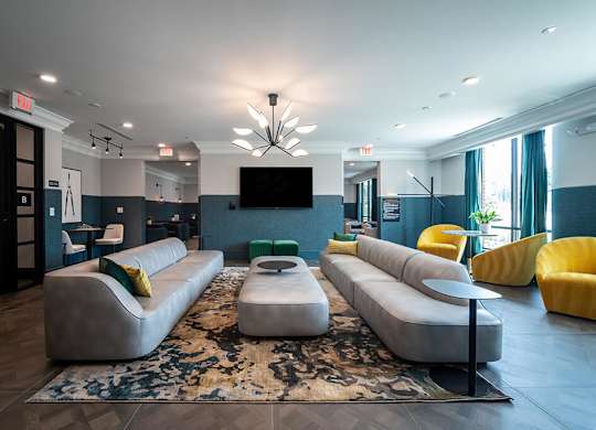 Social lounge seating room with tv at The Belhaven in Alexandria VA