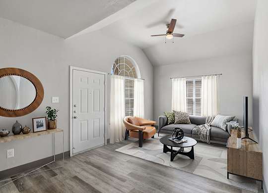 Living room with ceiling fan at Almeda Park Apartments in Houston TX