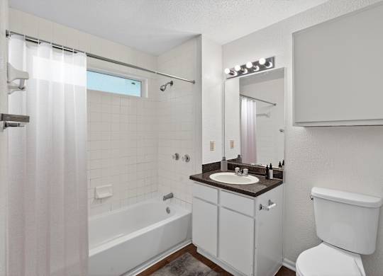Bathroom at Dayton Park Apartments in Dayton TX