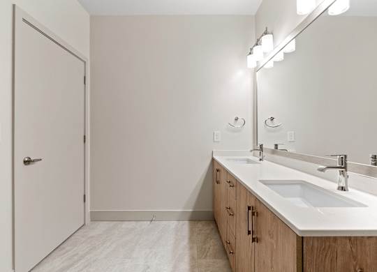 Vacant bathroom double sink at VERO Apartments in Chelsea MA