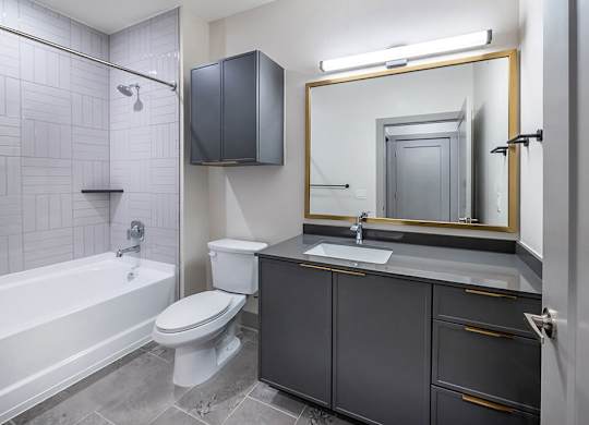 Bathroom with toilet and shower at Heights at 1520 Apartments in Houston TX