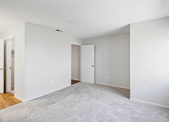 Carpeted bedroom at Hilltop Commons Apartments in San Pablo CA