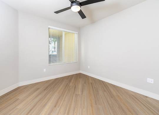 Vacant Metallic Rose Design Package Bedroom at Bowen Apartments in San Diego CA