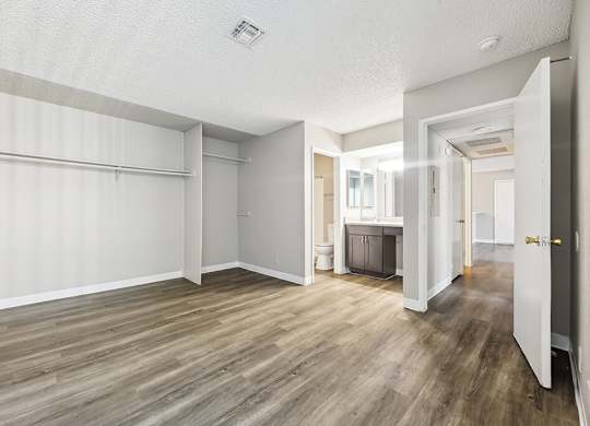 Vacant Primary Bedroom and Bathroom at Woodcreek Apartments in Las Vegas NV