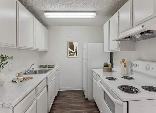 Kitchen with appliances at Ridgemoor Apartment Homes in Lakewood CO