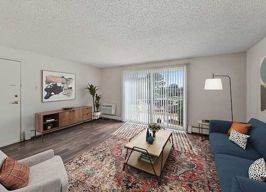Living room with hardwood flooring at Ridgemoor Apartment Homes in Lakewood CO