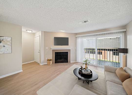 Living room with fireplace at Rock Peak on Sunset Apartments in Longmont CO
