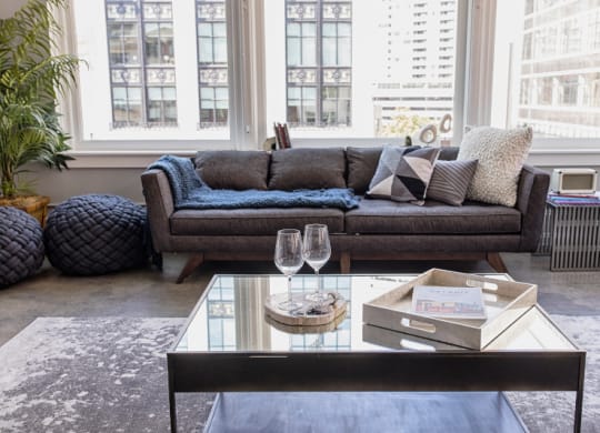 Living Room Filled with Furniture and a Large Table  at Fourteen56, Detroit, MI