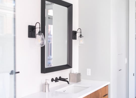 Bathroom with a Sink and a Mirror at Fourteen56, Detroit, MI